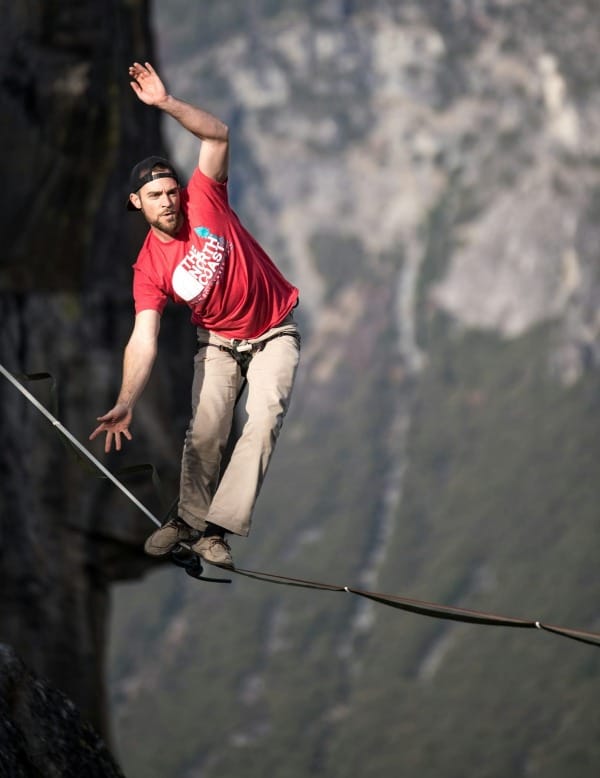 man waking on rope